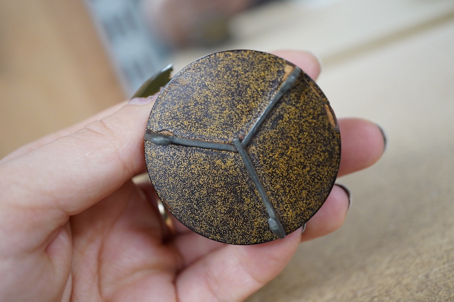 A Japanese miniature cylindrical lacquer box, 19th century, with applied carved ivory flower, 4.5cm in diameter. Condition - one interior section missing CITES Submission reference Z9FUK266